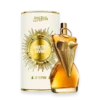 Perfume bottle with a gold sunburst emblem beside a white cylindrical box labeled Gaultier Divine.