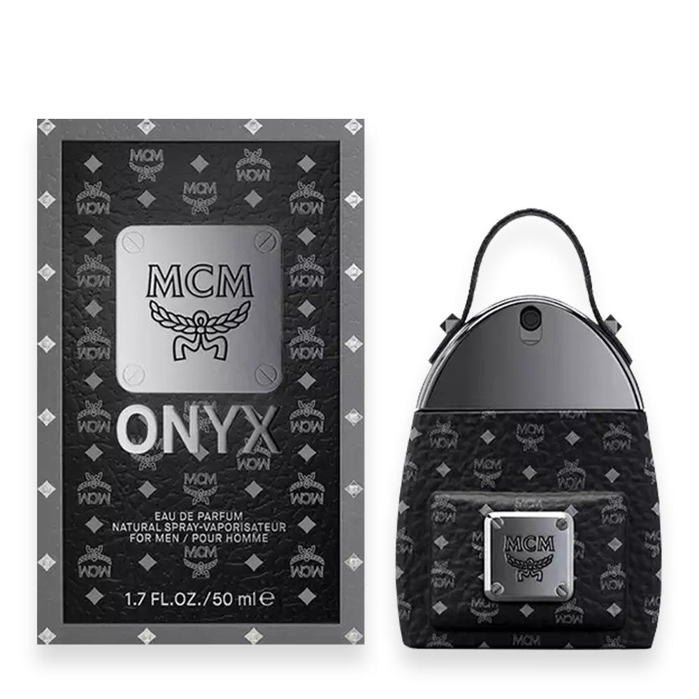 MCM Onyx Eau de Parfum » Scott Beauty Shop MCM Onyx perfume box next to a small black patterned backpack with a silver plaque and logo detailing.
