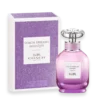 Coach Dreams Moonlight perfume bottle beside a purple glittery box, pink gradient glass with silver cap, label reads 'Coach Dreams Moonlight'.