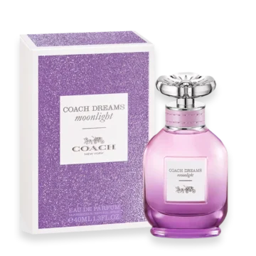 Coach Dreams Moonlight perfume bottle beside a purple glittery box, pink gradient glass with silver cap, label reads 'Coach Dreams Moonlight'.