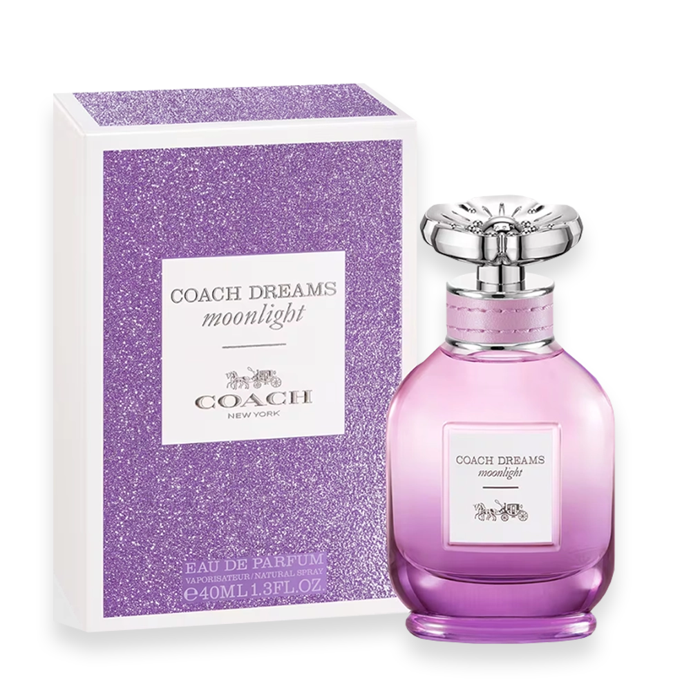 Coach Dreams Moonlight » Scott Beauty Shop Coach Dreams Moonlight perfume bottle beside a purple glittery box, pink gradient glass with silver cap, label reads 'Coach Dreams Moonlight'.