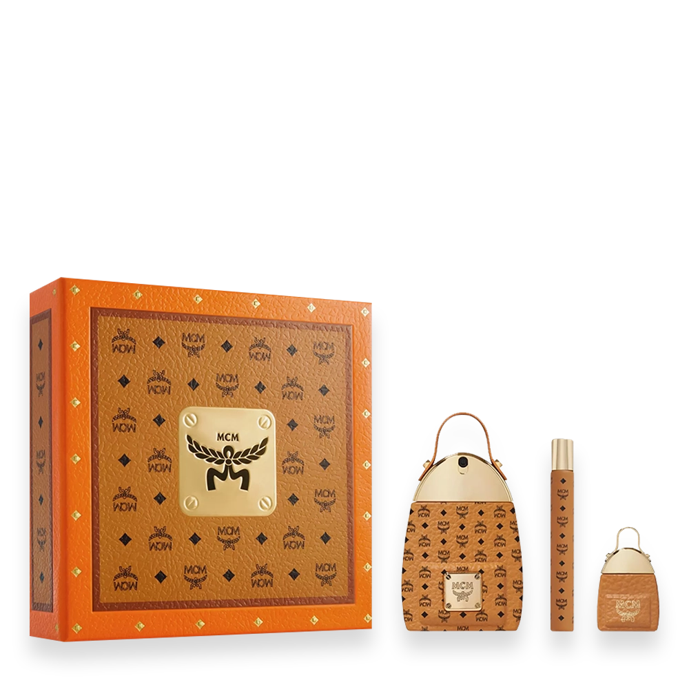 MCM Gift Set Eau de Parfum » Scott Beauty Shop Orange MCM gift box with gold crest and monogram pattern, accompanied by a coordinating monogram handbag, perfume bottle, and travel spray.