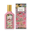 Bottle of Gucci Flora Gorgeous Gardenia perfume with floral design