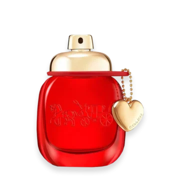 Red glass perfume bottle with a gold cap and a gold heart charm hanging from a red ribbon, reflecting luxury