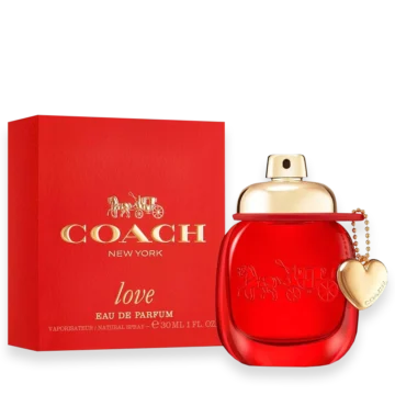 Coach New York Love perfume bottle with red glass, gold cap, and heart charm beside a matching red box.
