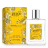 Perfume bottle with yellow floral box labeled 'pure grace pop of sun' by Philosophy, eau de toilette spray.