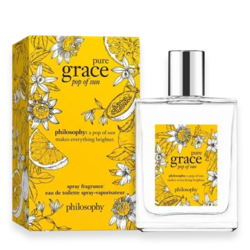 Perfume bottle with yellow floral box labeled 'pure grace pop of sun' by Philosophy, eau de toilette spray.